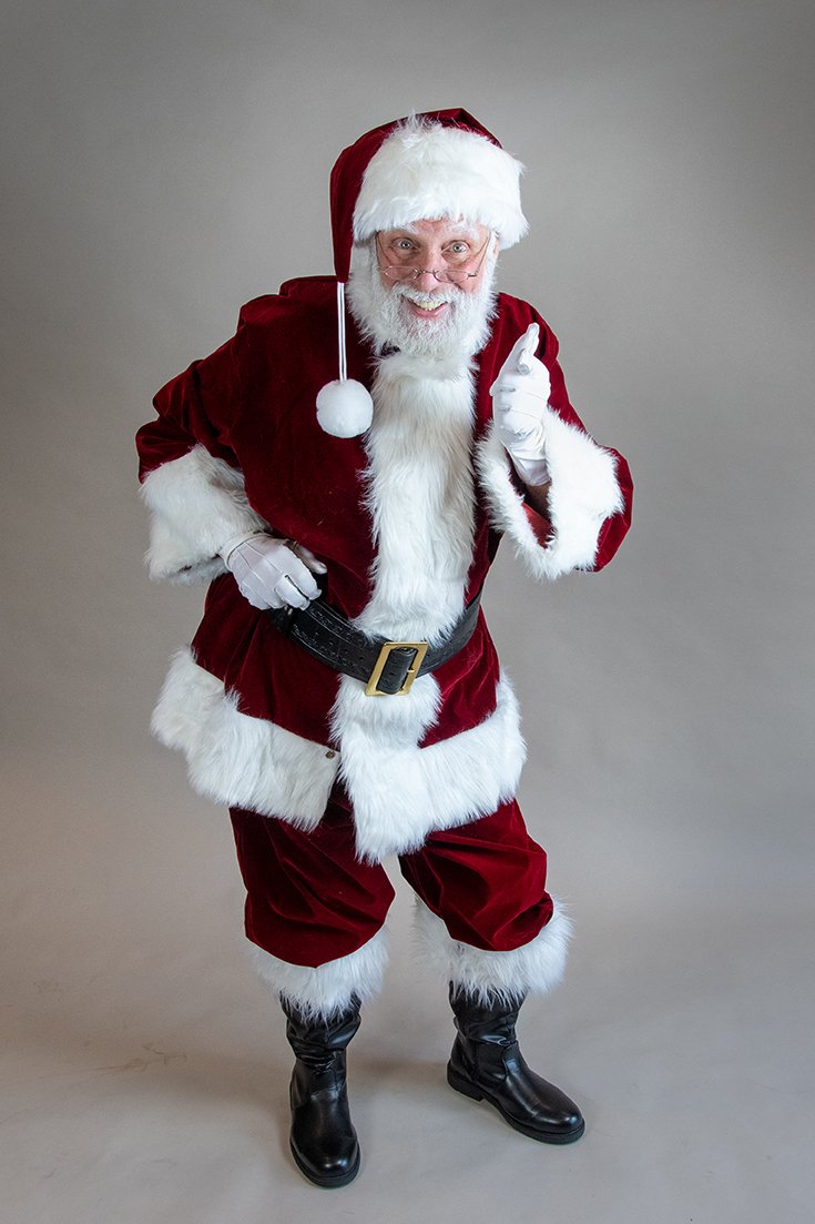 Full length portrait of Long Island Santa Mike Maione, AKA The Silly Magician.